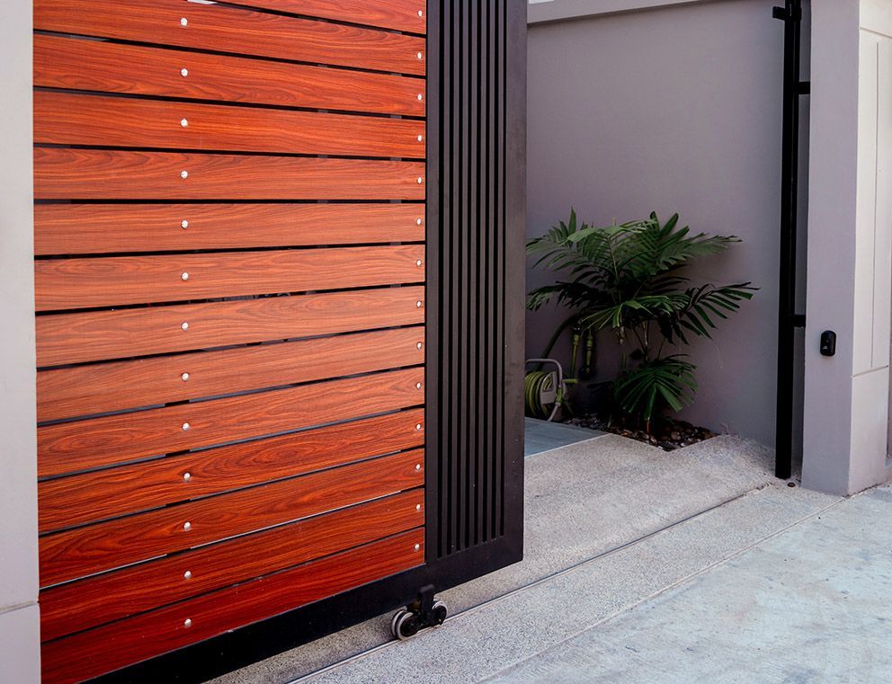 A Wooden Slat Automatic Sliding Gate — Coastal Auto Garage Doors & Gates In Caboolture, QLD