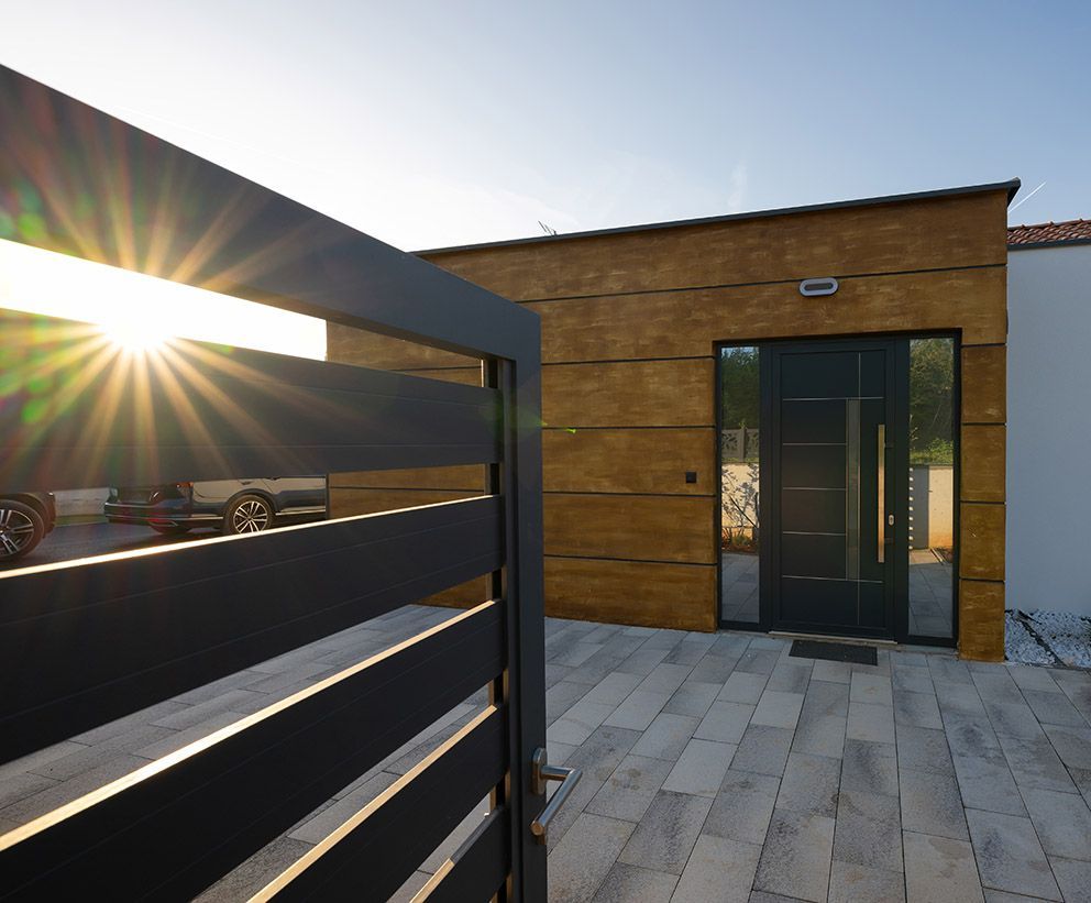 A Grey Metal Automatic Gate Opening — Coastal Auto Garage Doors & Gates In Narangba, QLD