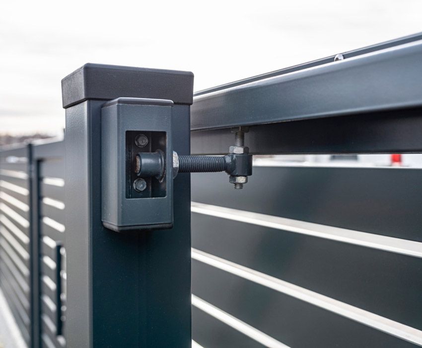 A Hinged Black Metal Swing Gate — Coastal Auto Garage Doors & Gates In Burpengary, QLD