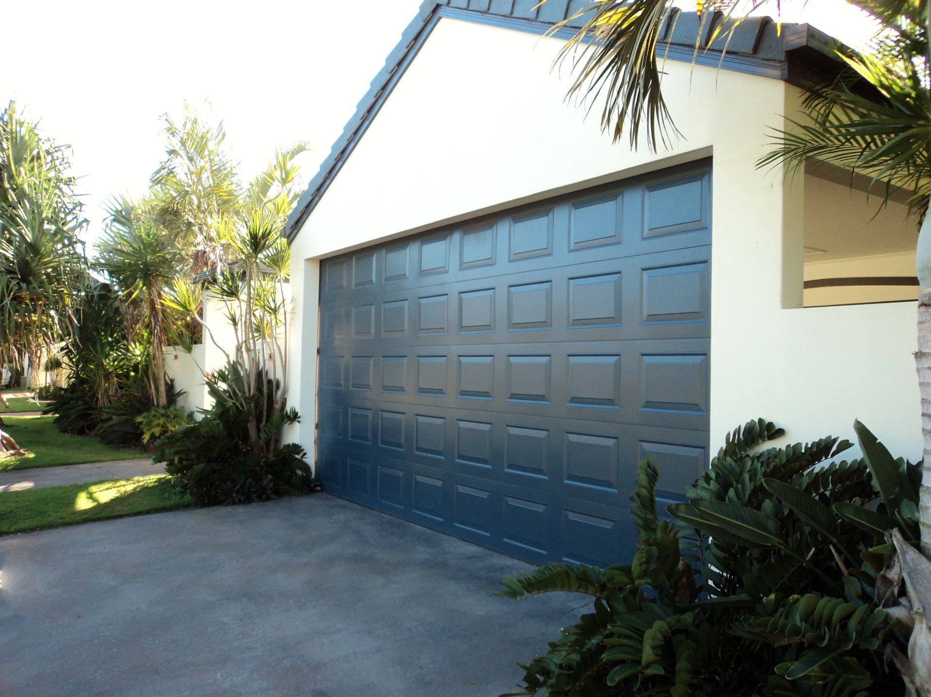 A Garage Door On The Front Of A House  — Coastal Auto Doors & Gates In Nambour, QLD