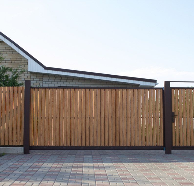 Automatic Gate with Vertical Wooden Slats — Coastal Auto Garage Doors & Gates In Caboolture, QLD