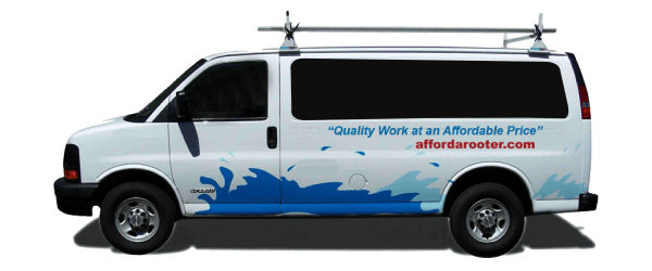 White utility van with a blue water splash graphic, ladder rack, and 