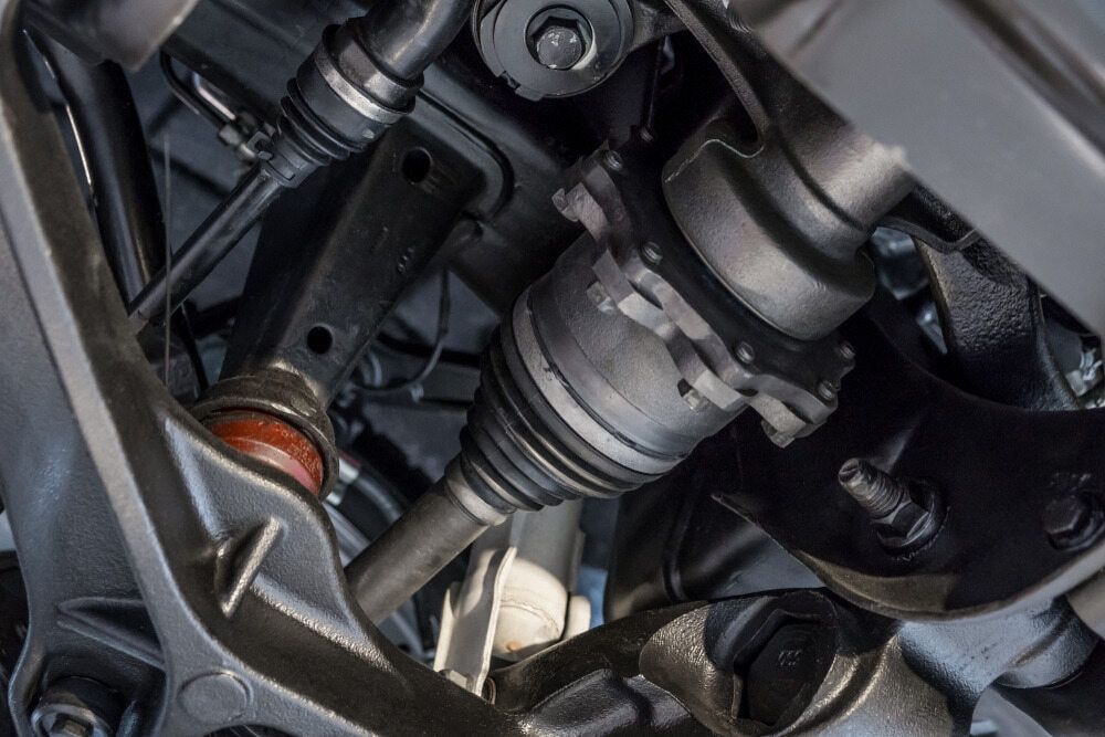 Undercarriage of a Vehicle, Showing a Drive Shaft and Suspension Components — Burcher EFI & Service Centre in Orange, NSW