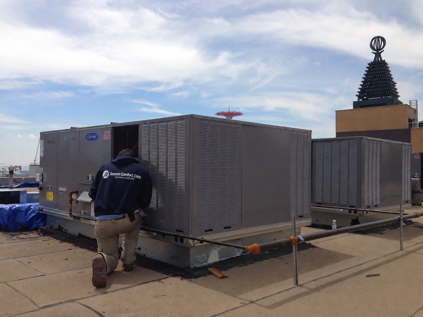 Large outdoor data center units with white server enclosures on raised platforms and black cooling pads below