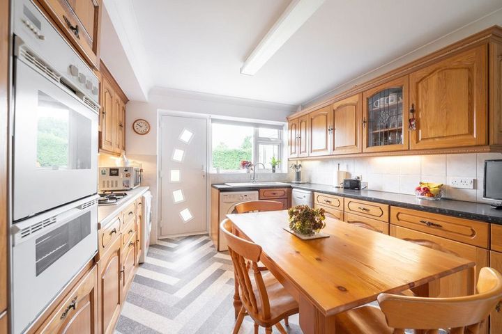 A Kitchen with Wooden Cabinets, a Table and Chairs in Twin Falls, ID