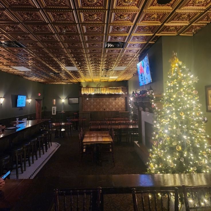 There is a christmas tree in the middle of the room.