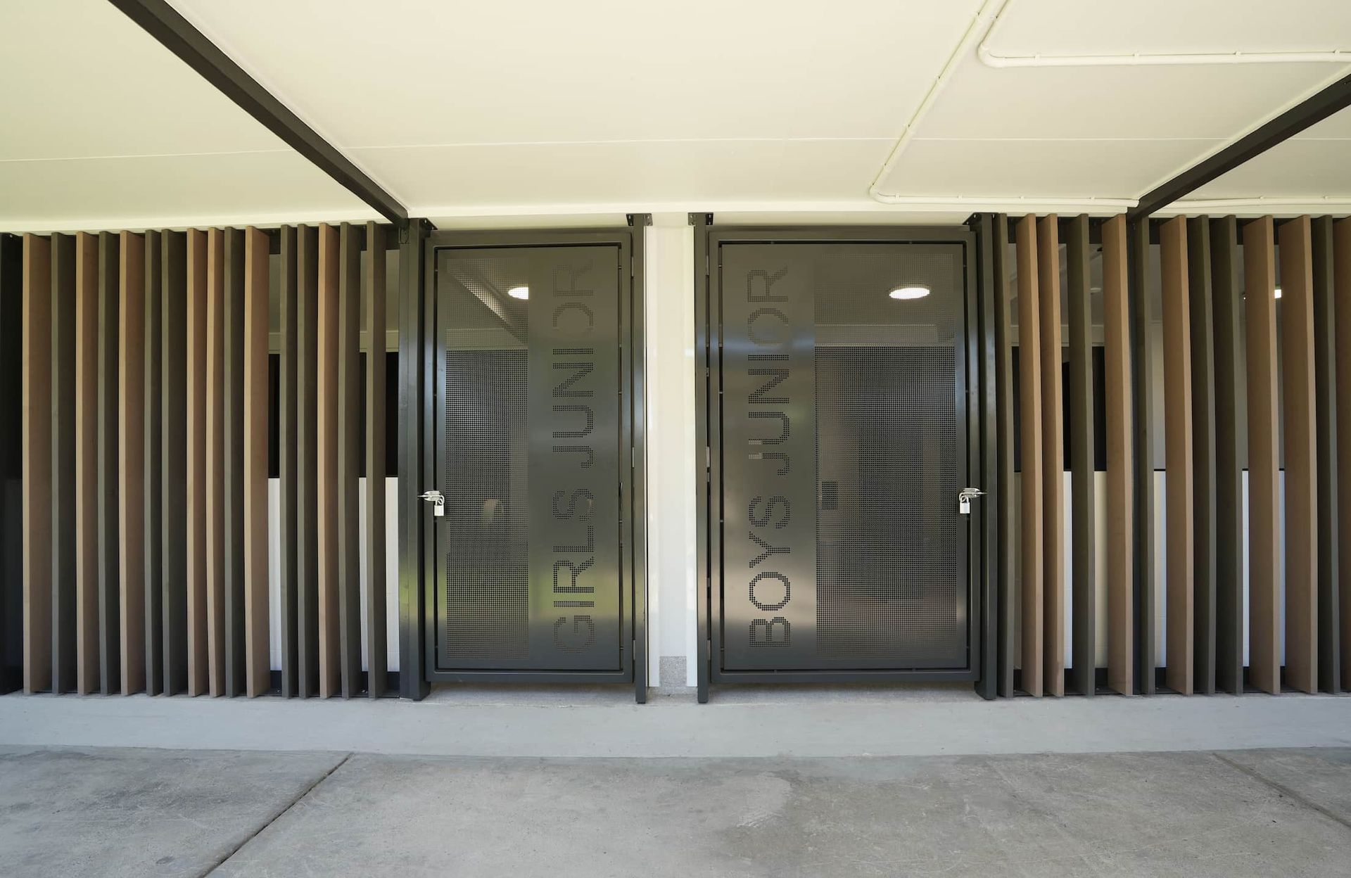 a door that says girls junior and boys junior on it