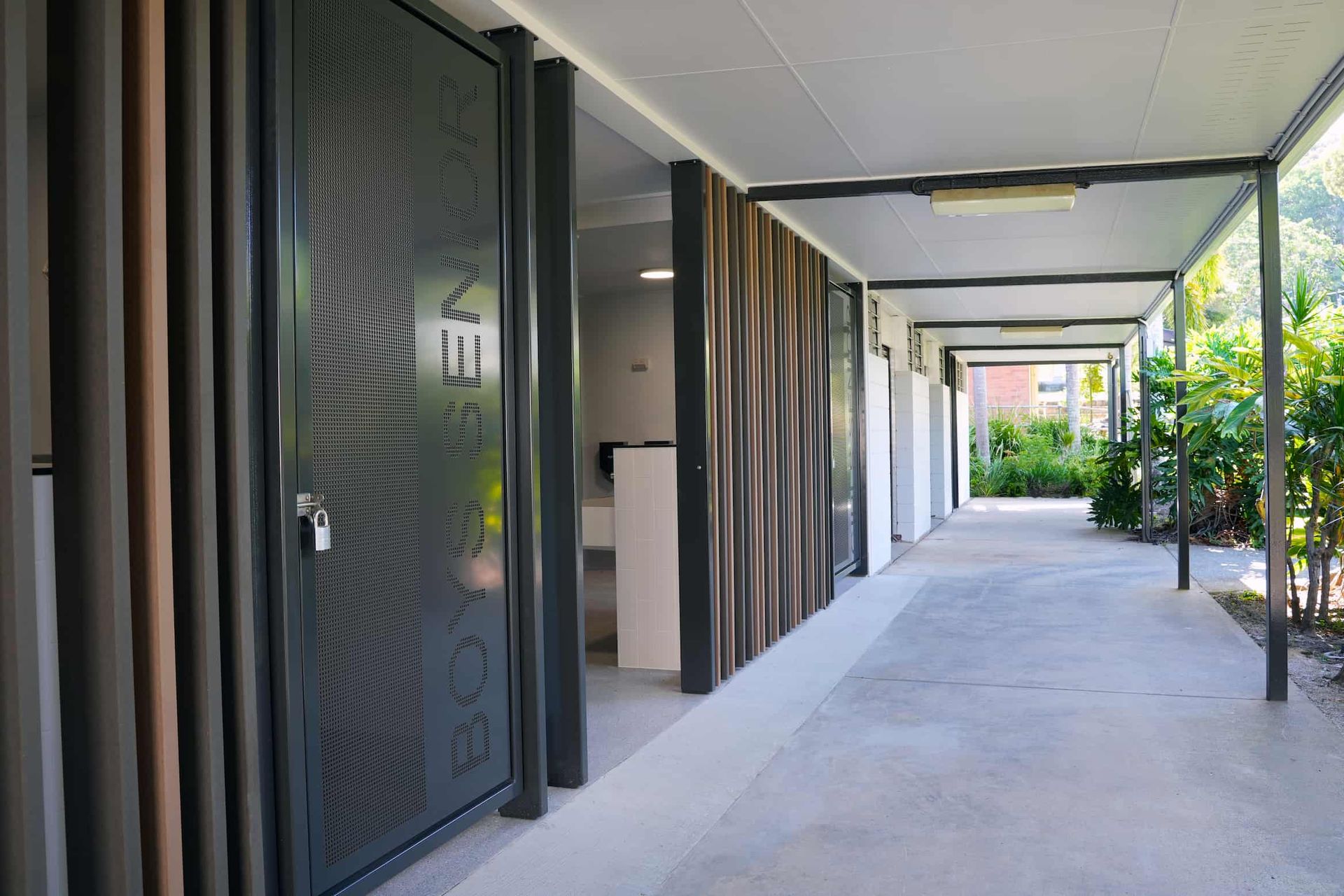 a hallway with a door that says ' boys on it