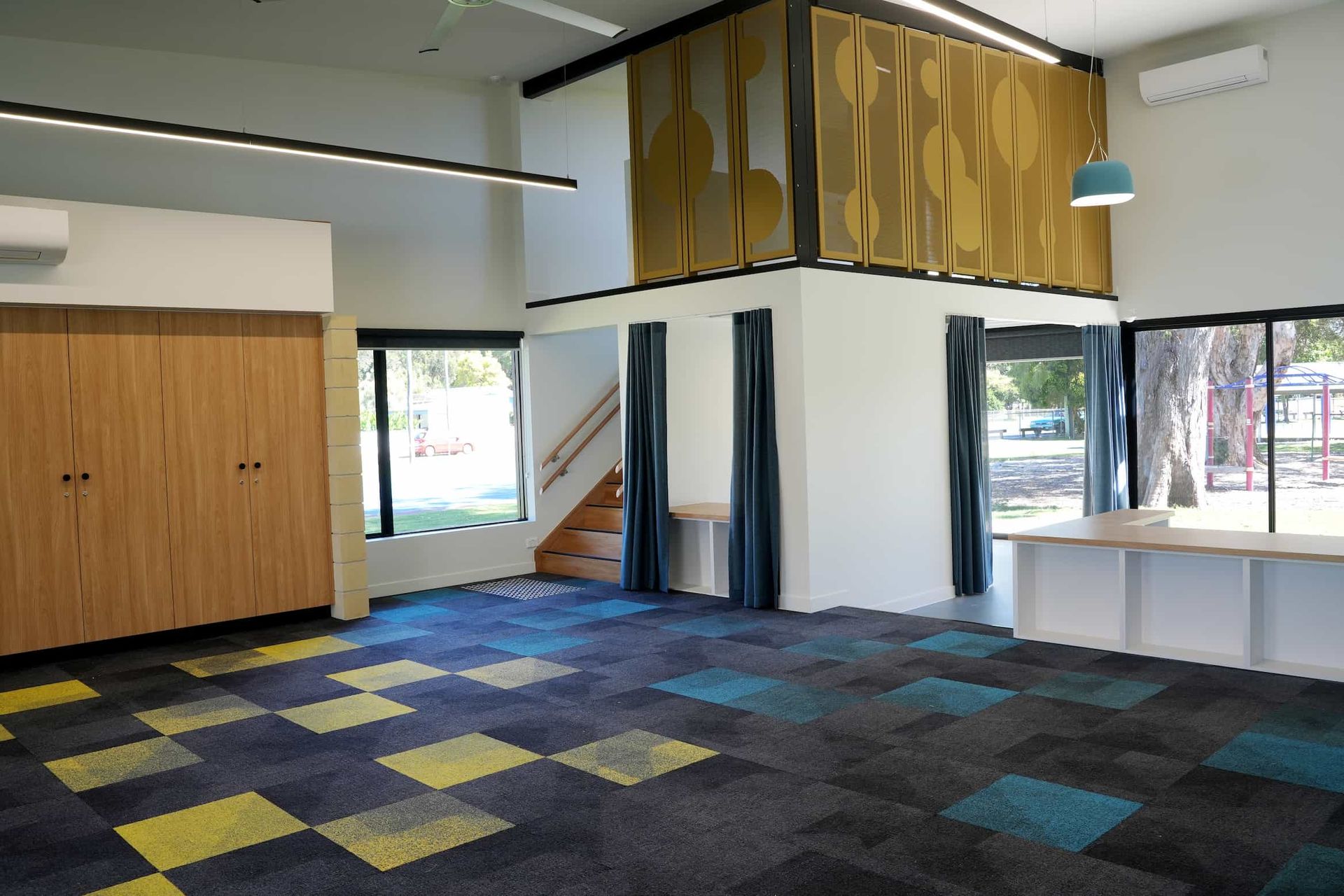 a school room with a blue and yellow checkered floor