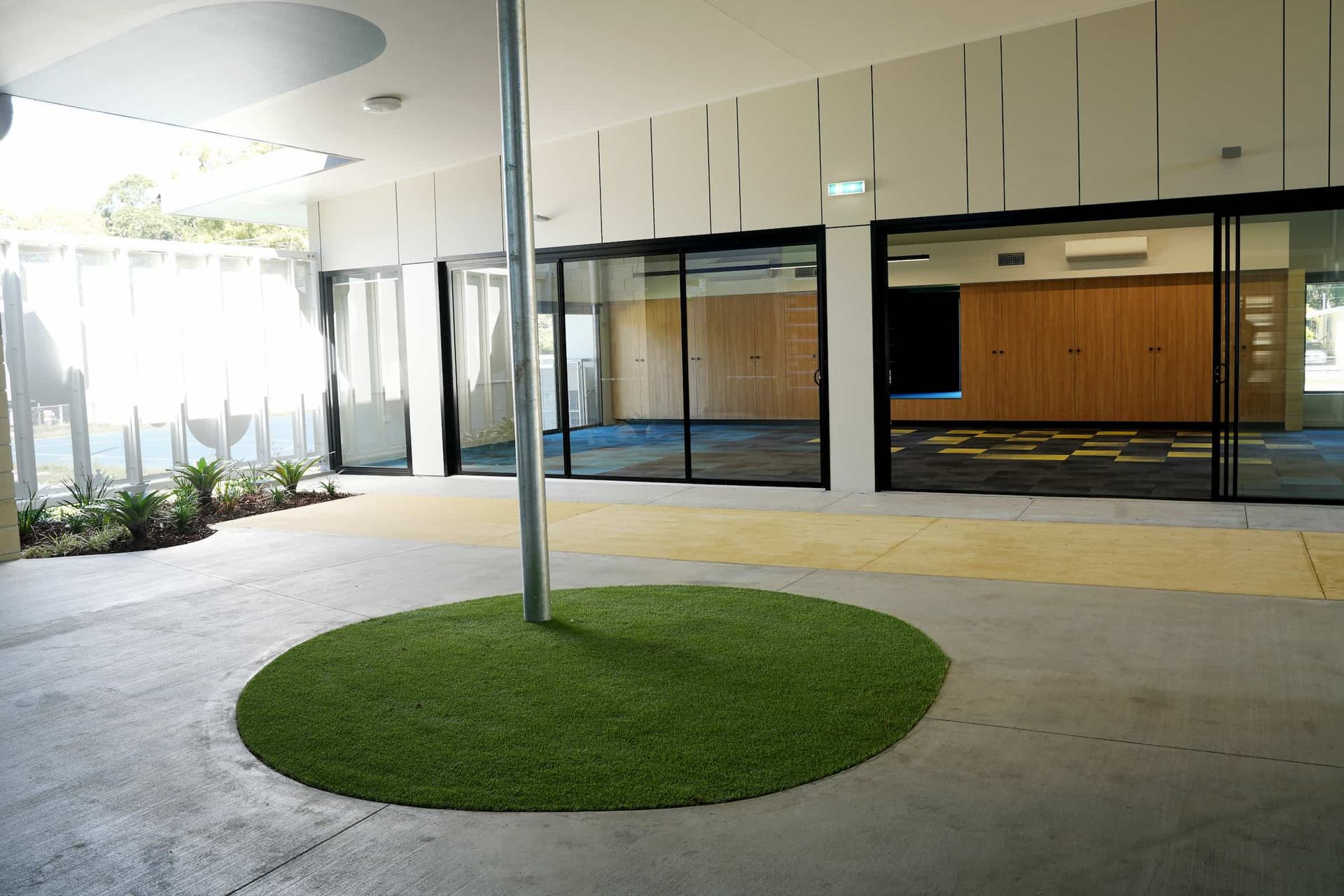 a room with sliding glass doors and a sign that says exit