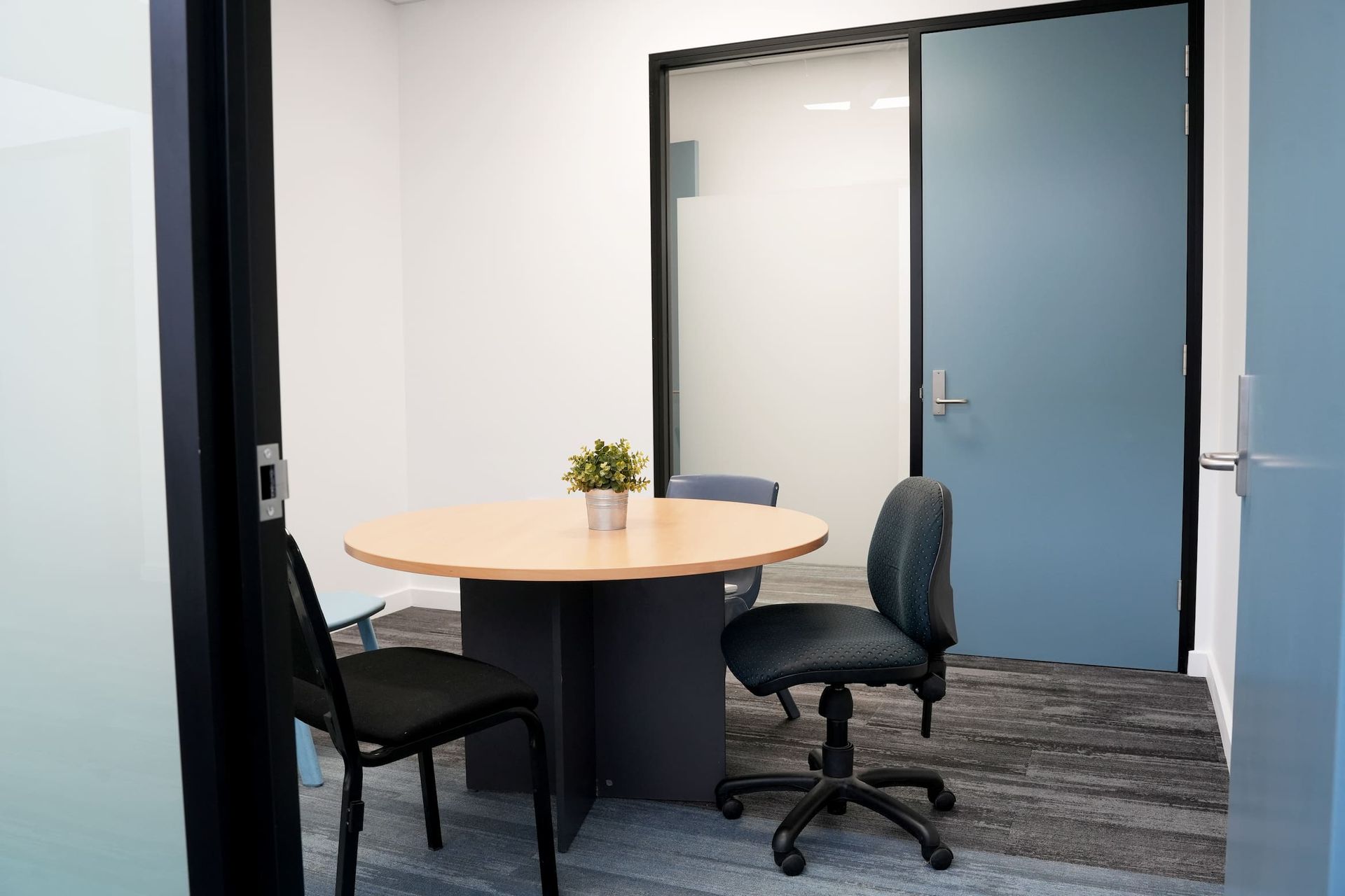 there is a table and chairs in the room at Shailer Park SHS Health Hub