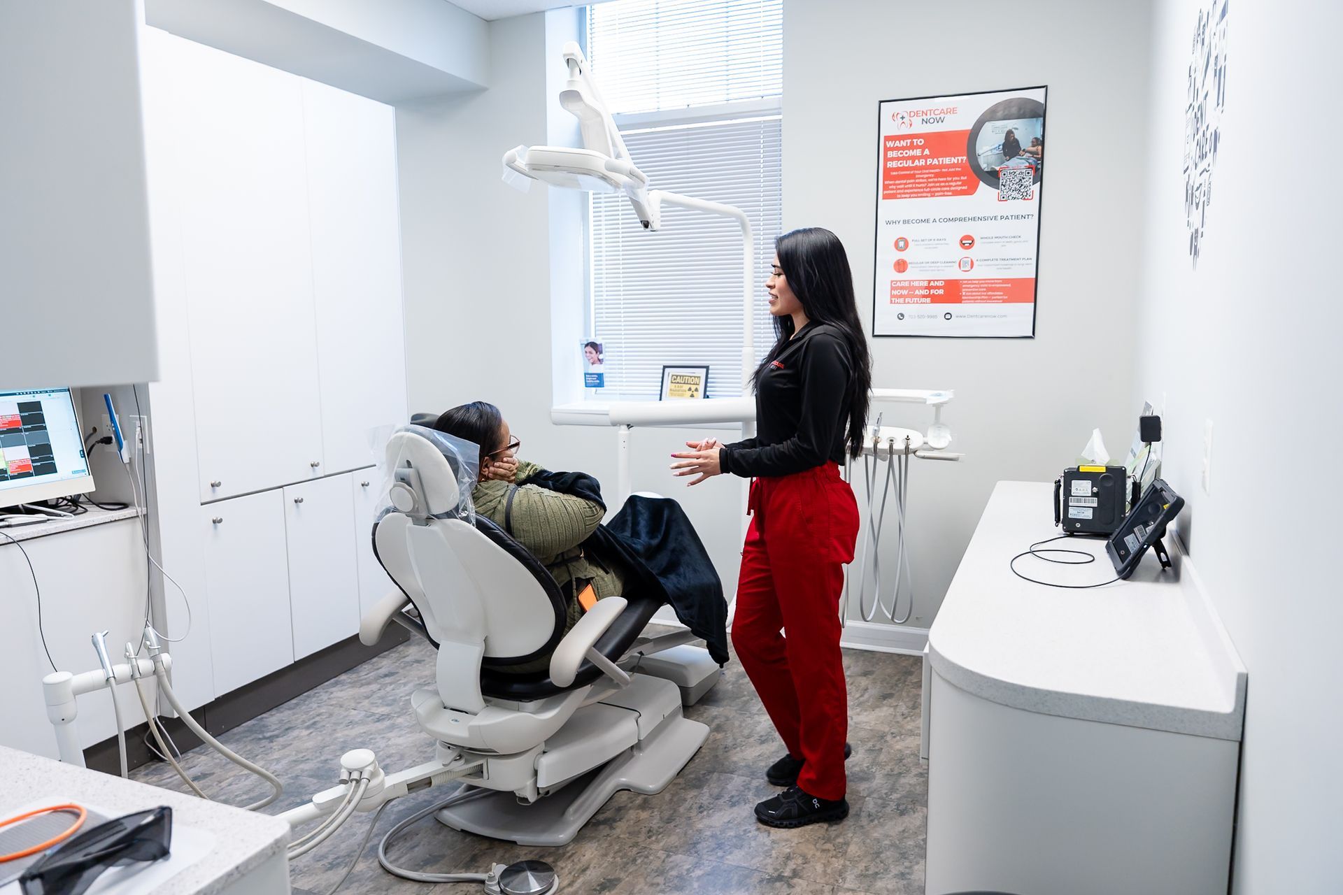 Dentist examining a patient in a bright modern dental clinic at DentCare Now, emergency dentist serving Fairfax, VA