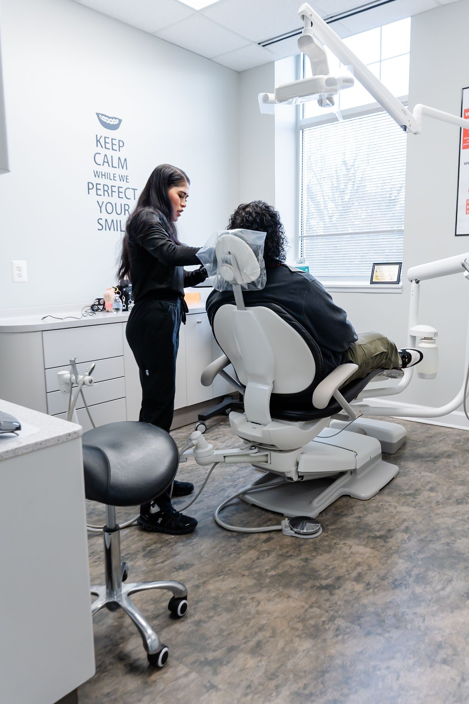 Dental exam room with patient in reclining chair at DentCare Now, emergency dentist serving Fairfax, VA