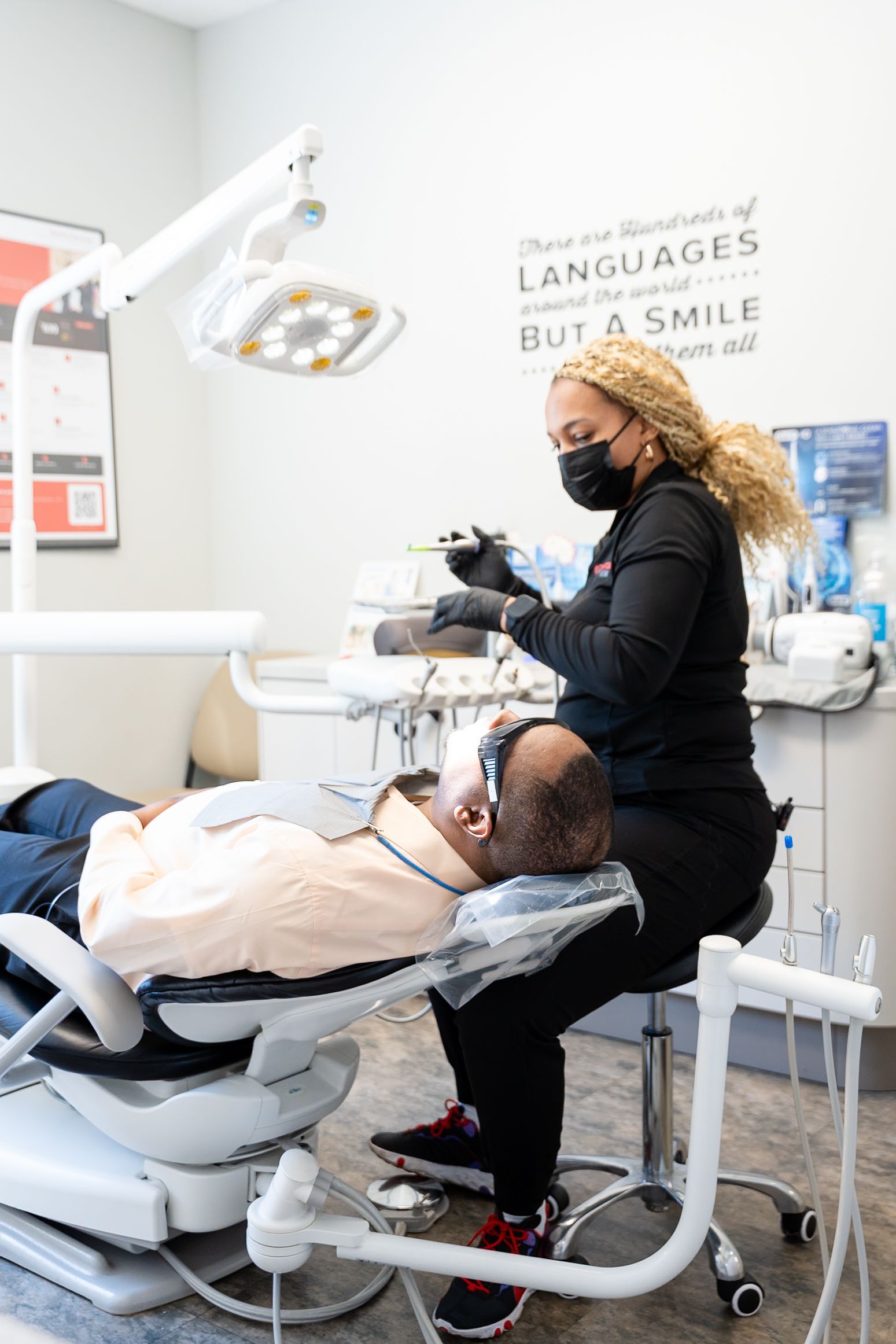 Dental hygienist treating a patient in a dental clinic at DentCare Now, emergency dentist serving Fairfax, VA