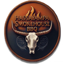Hassayampa Smokehouse BBQ logo with a longhorn skull, rope border, and flames on a brown circular badge