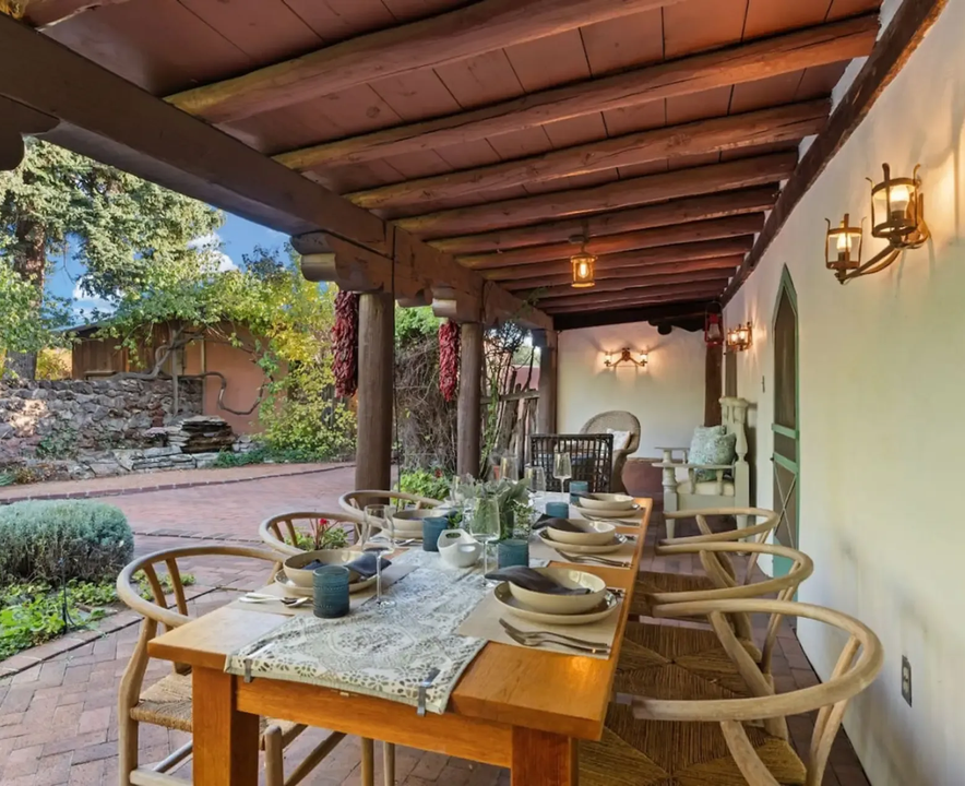 Outdoor dining beneath the Boyle House’s timber portal