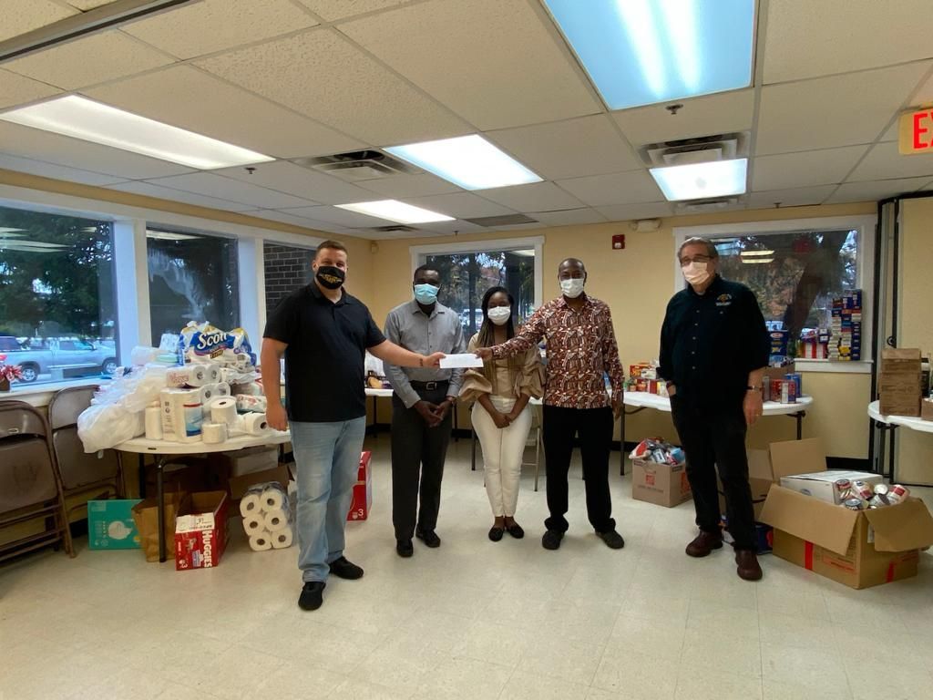 Tema Choir USA presenting fundraising donation to Rising Hope United Methodist Mission Church, Alexandria VA. To the far left is Lead Pastor Rev. Dr. Keary C. Kincannon and to the far right is Pastor Kameron Wilds.