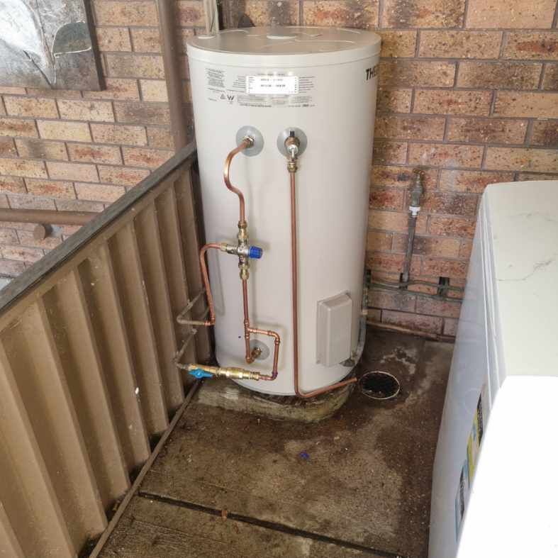 A Water Heater Installed Against a Brick Wall — Hunter Plumbing And Hotwater in Raymond Terrace, NSW