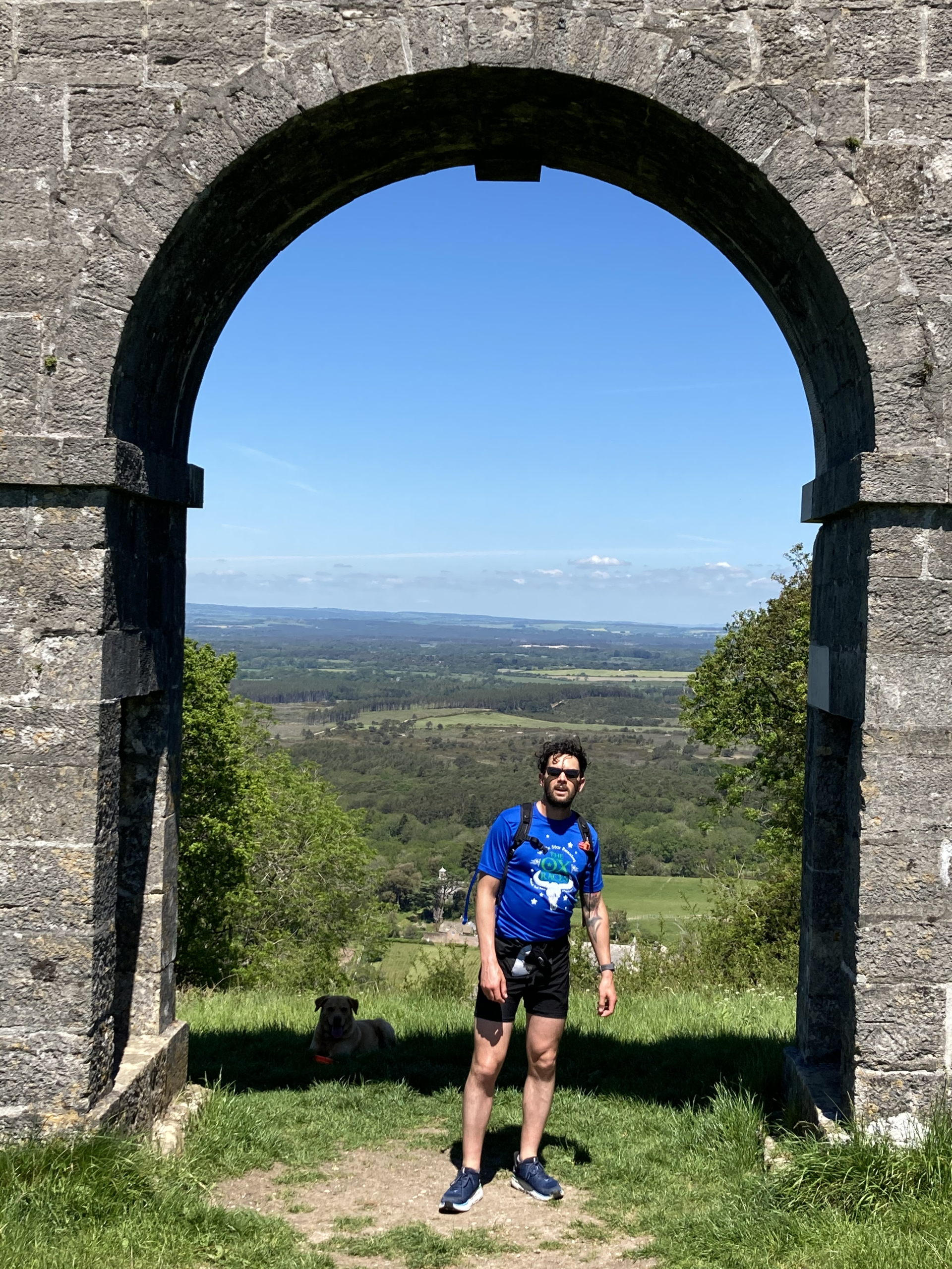 Jon Wilton under an arch on a trail run in Dorset