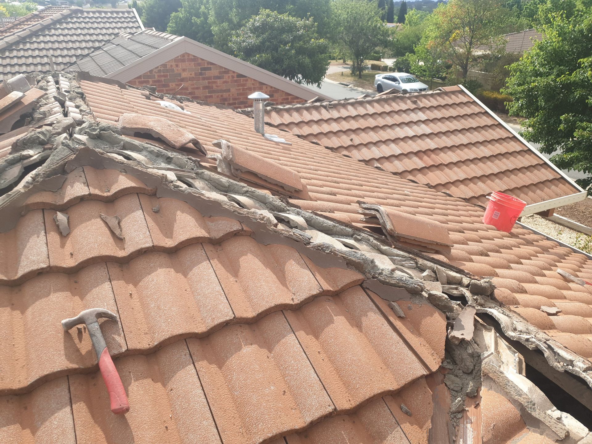 Tradie doing roof repair — Qualified Roofer in Canberra