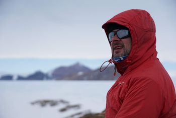 Image of Dr David Small wearing sunglasses and a jacket in the Antarctic