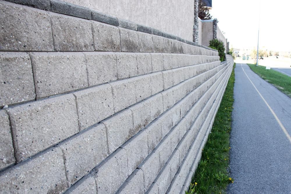 A Brick Wall Is Along The Side Of A Road — Dubbo Mini Mix & Landscape Supplies In Dunedoo, NSW