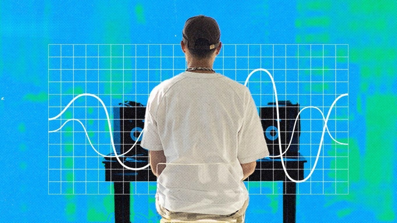 A person in a white shirt sits facing two speakers. Behind him, a grid overlaid with wavy white lines. The background is blue with green patches.