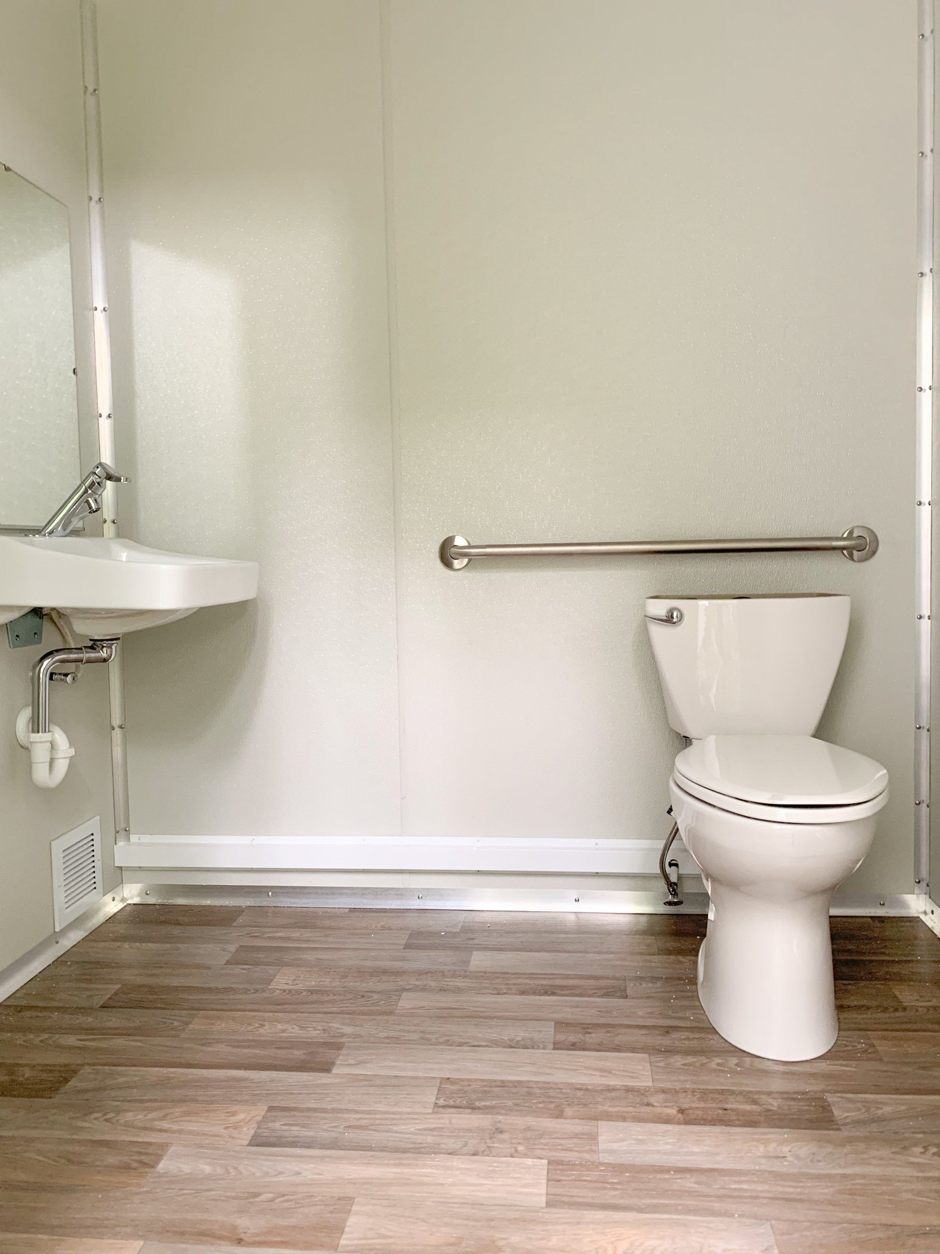 Accessible toilet with hand rail