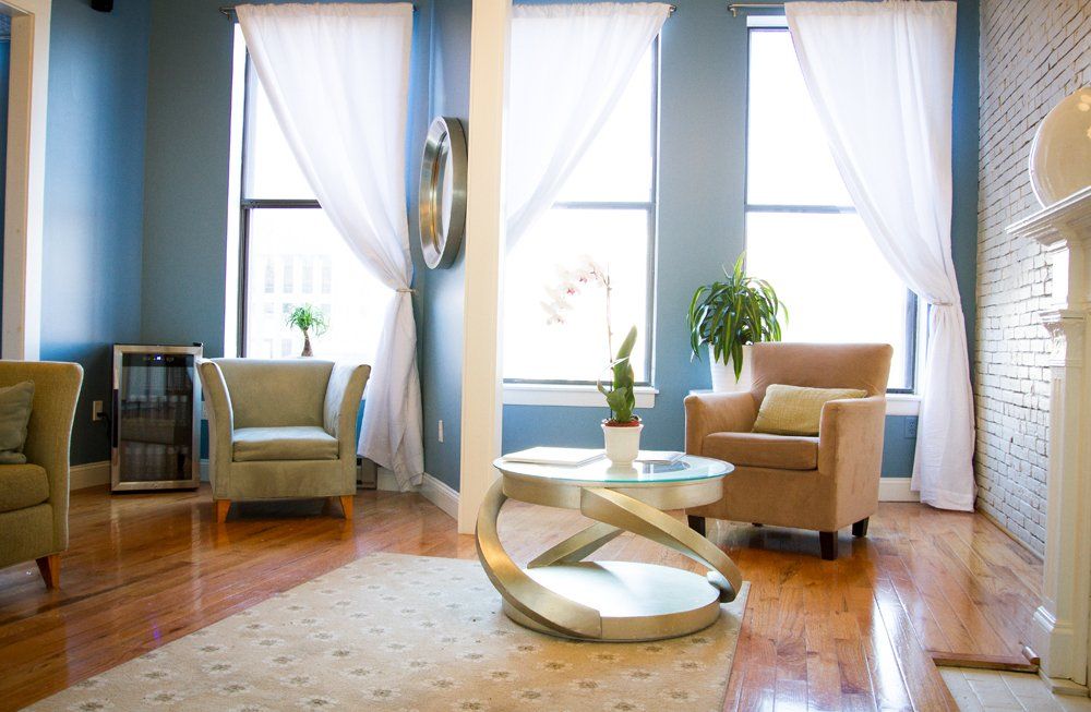 A living room with two chairs and a coffee table