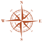 Rust-colored compass rose with N, E, S, and W directions on a white background