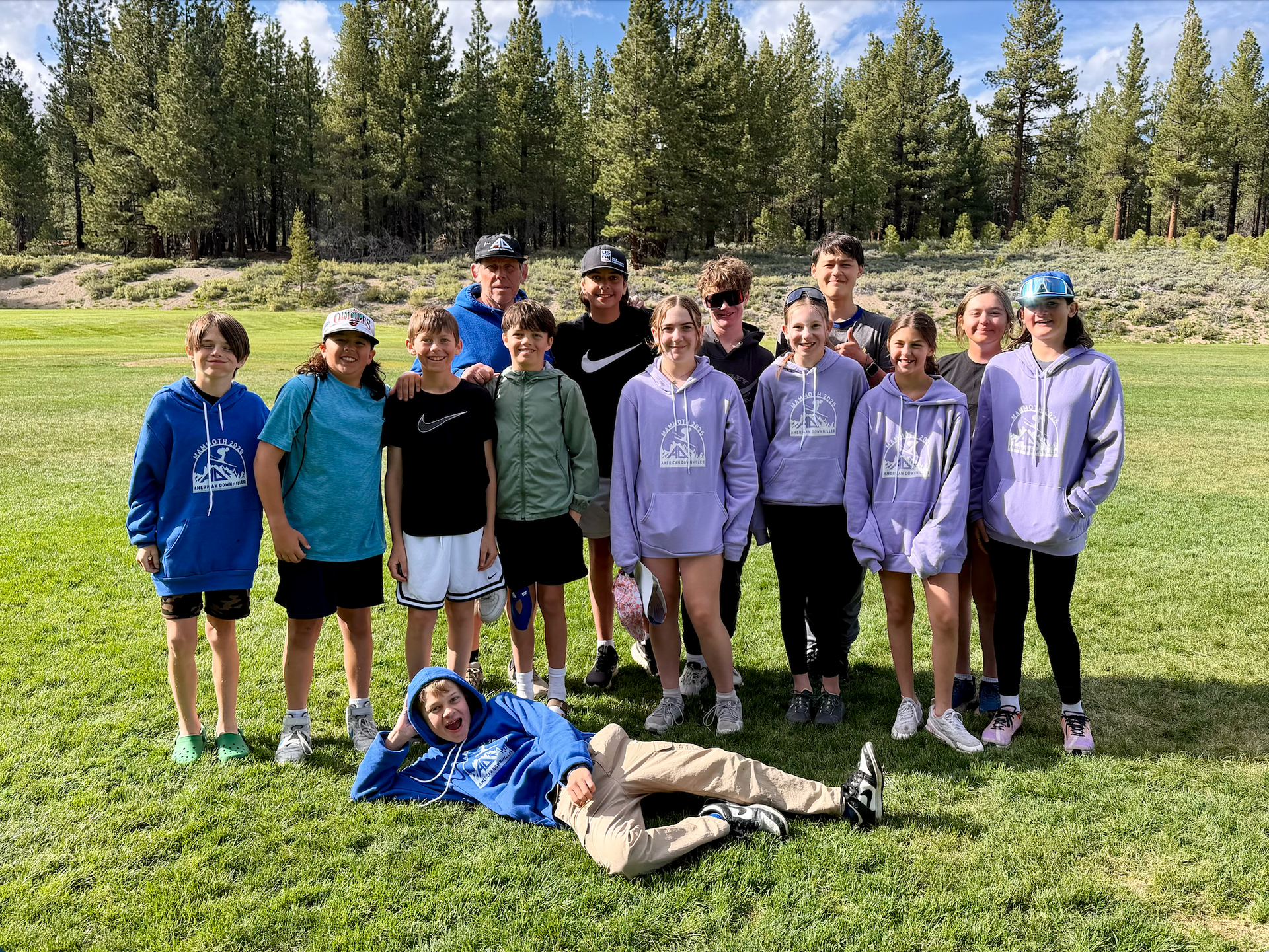 Coach Chris Brigham with a group of PCSS athletes at American Downhiller camp