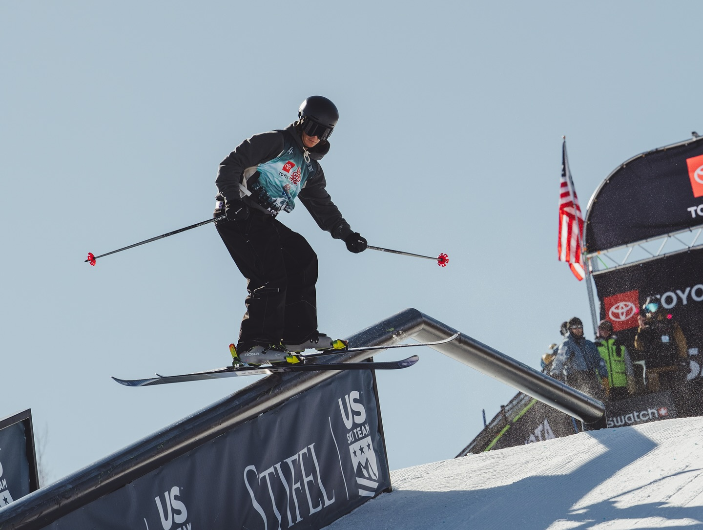 Athlete skiing a rail
