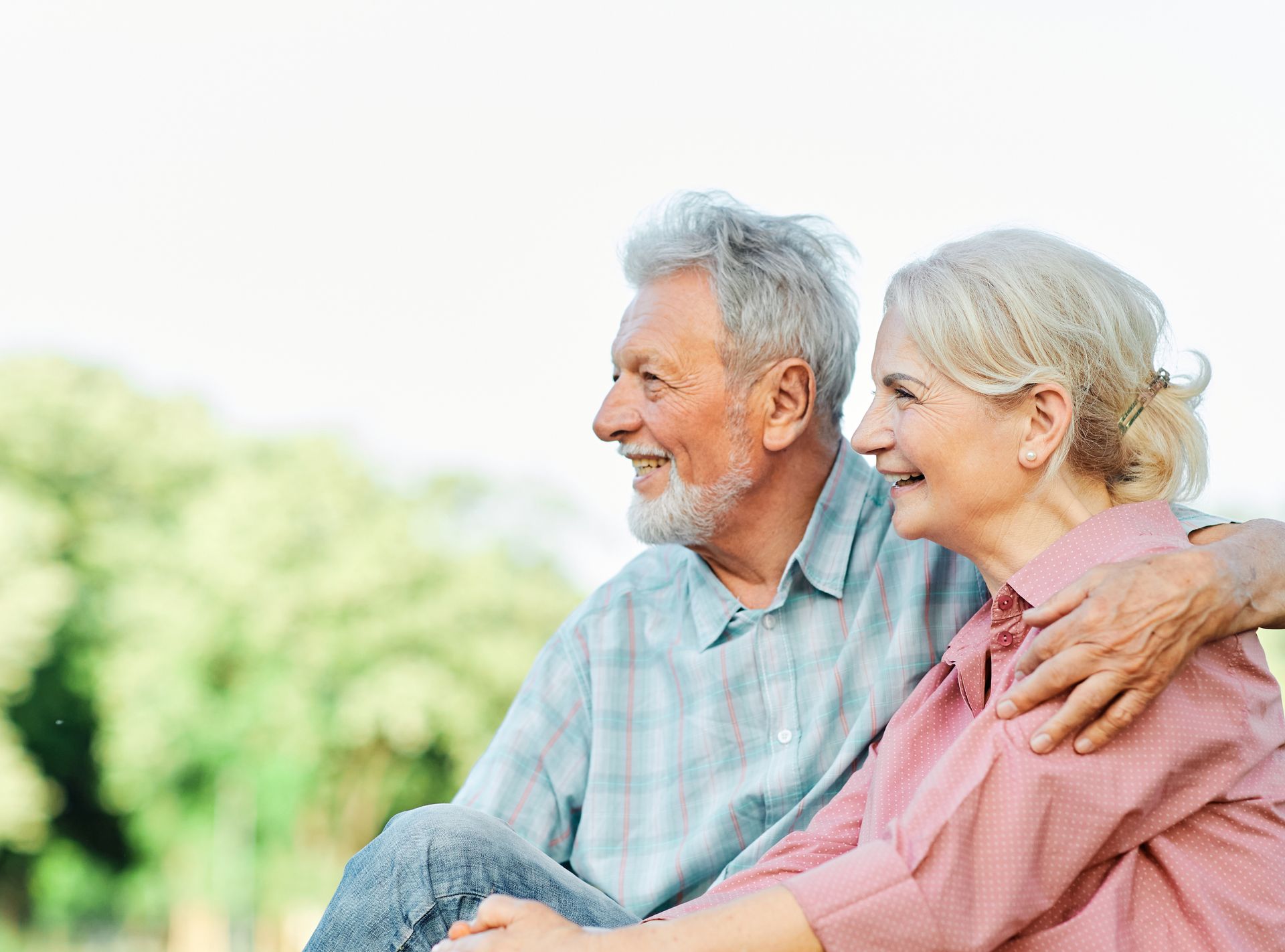 Active senior couple outdoors enjoying the retirement lifestyle that comes from smart planning