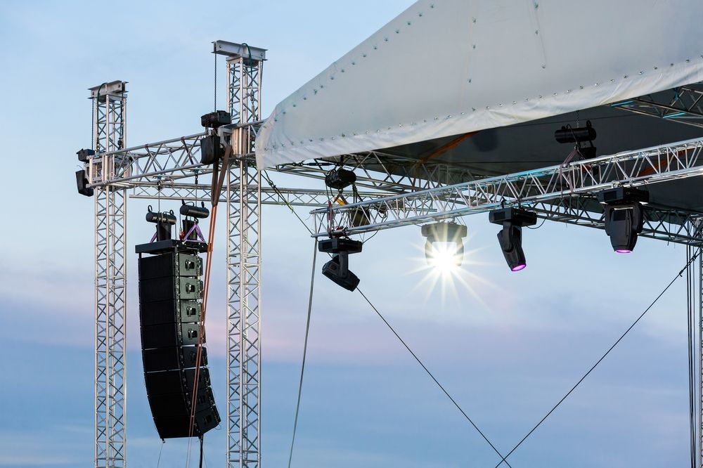 Outdoor Stage With Lighting Rig And Sound Equipment Set — Kennedy Amplifier Hire Service In South Mackay, QLD