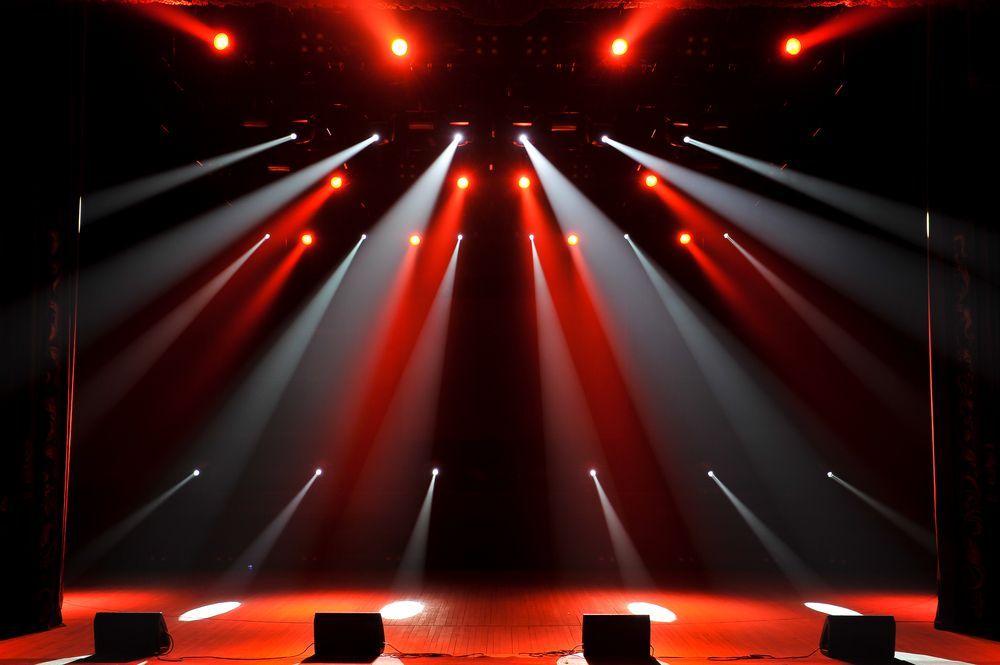 Stage Lit With Red and White Spotlights — Kennedy Amplifier Hire Service In South Mackay, QLD