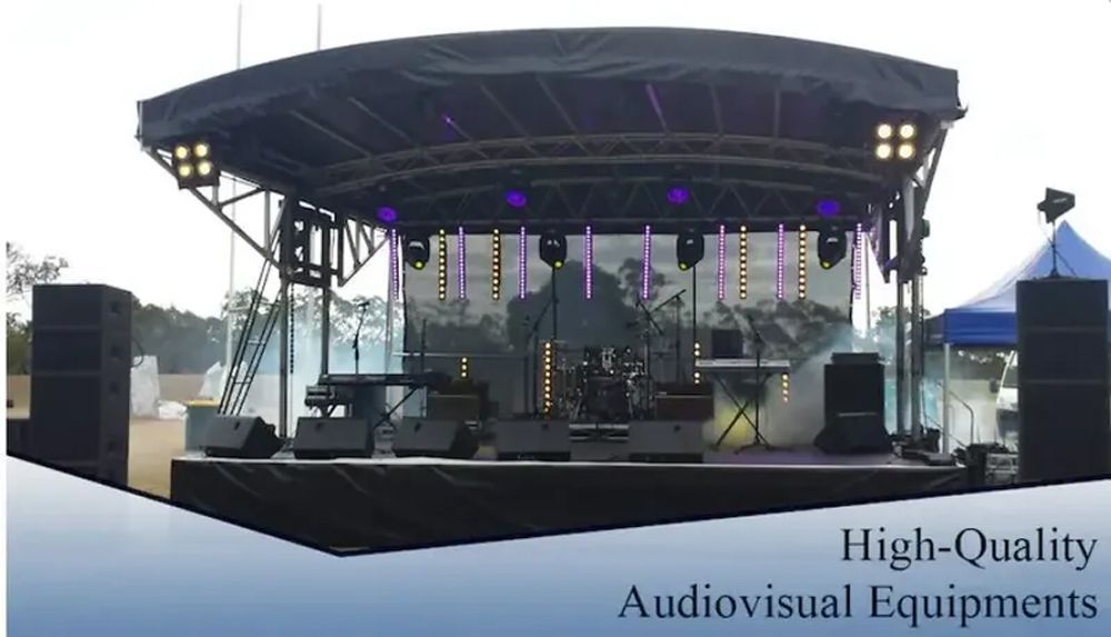 Outdoor Stage Setup With Lighting And Sound Equipment — Kennedy Amplifier Hire Service In South Mackay, QLD