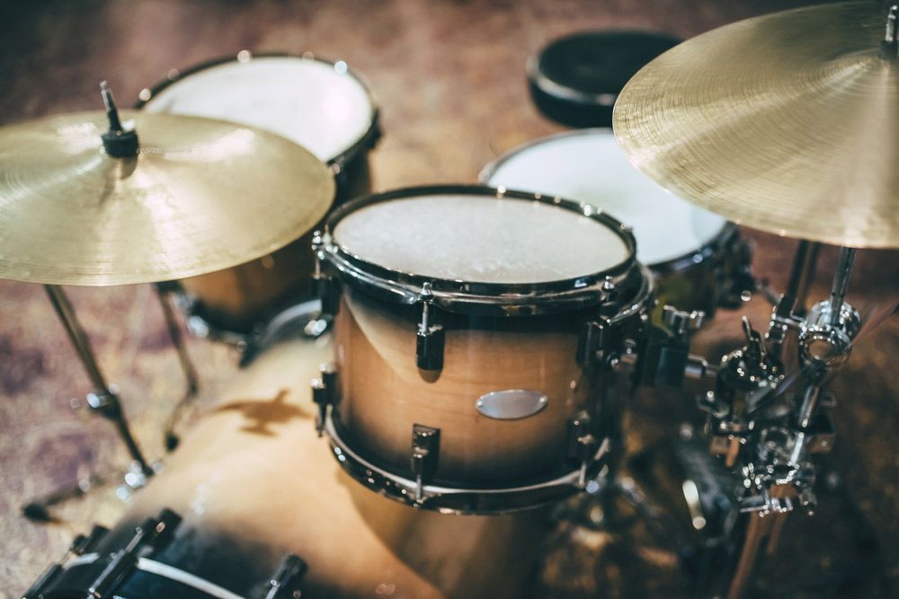 Drum Set With Brown And Gold Drums, Cymbals, And Hardware — Kennedy Amplifier Hire Service In South Mackay, QLD