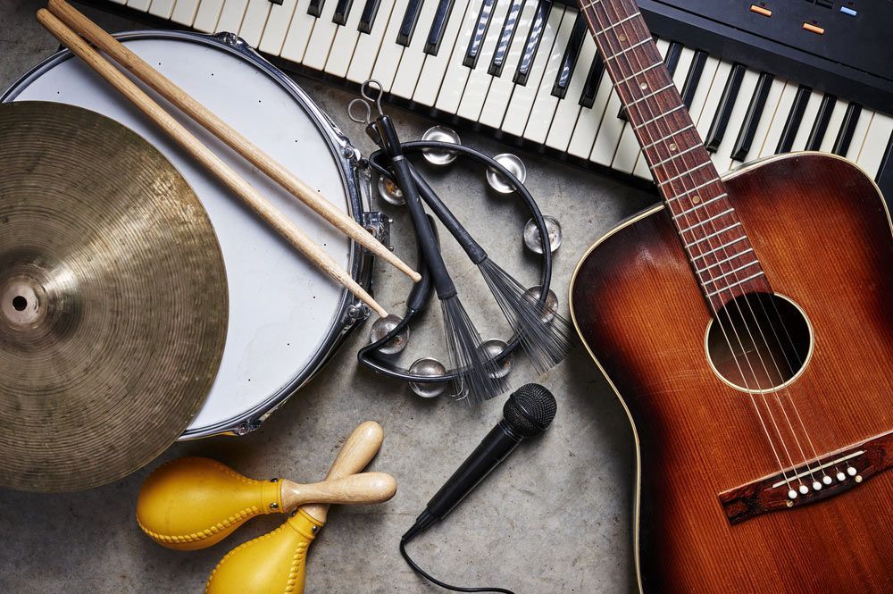 Assortment Of Musical Instruments Including A Guitar, And Keyboard — Kennedy Amplifier Hire Service In South Mackay, QLD