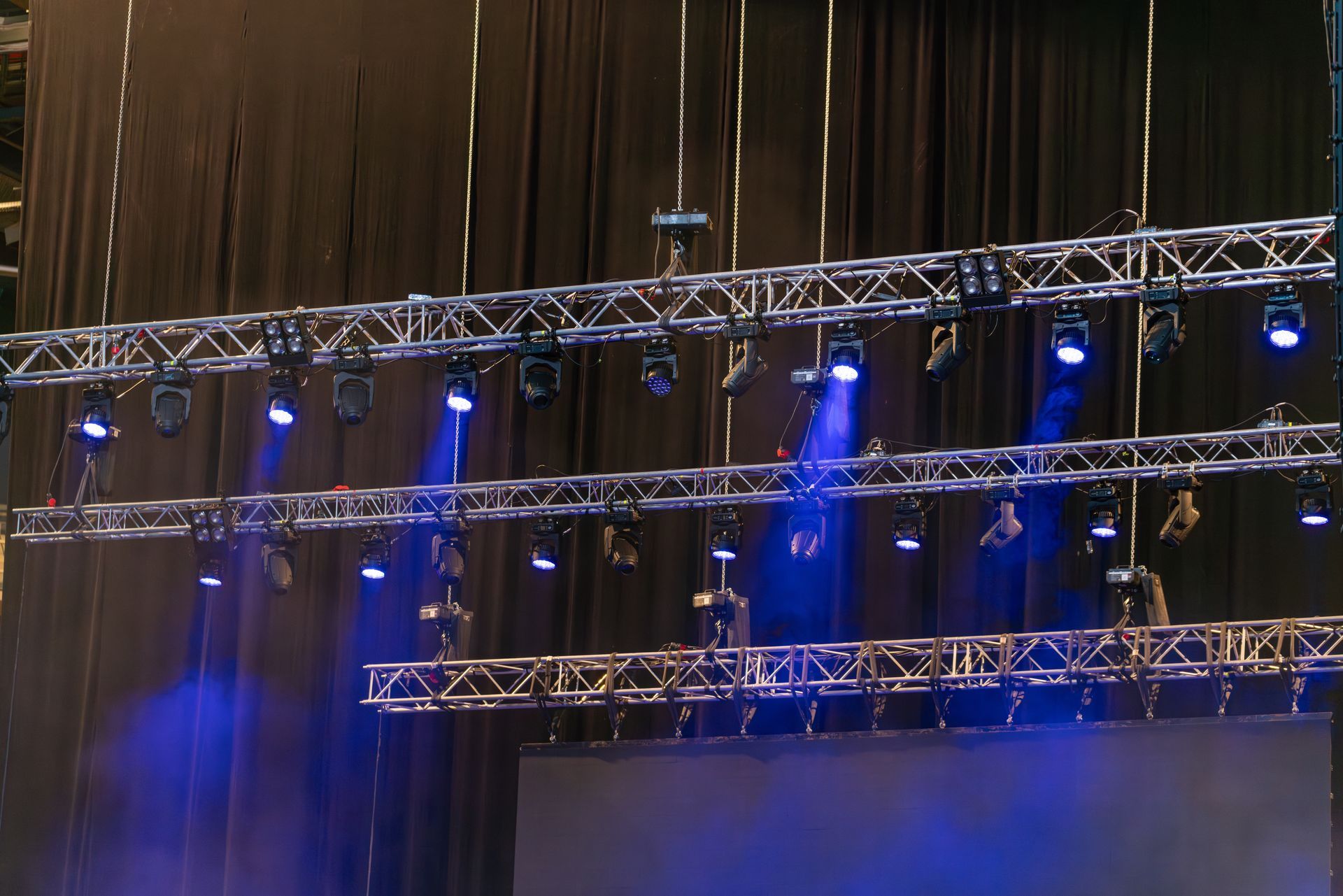 Stage Lighting Rig With Blue Spotlights — Kennedy Amplifier Hire Service In South Mackay, QLD