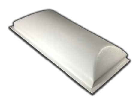 White wrapped bar of soap on a plain background