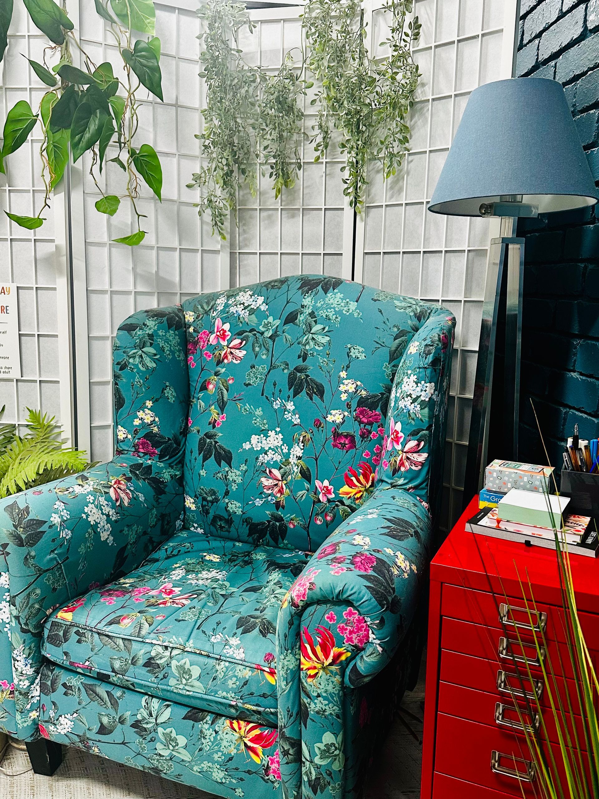A Woman In A Pink Shirt Is Talking To A Woman In A Plaid Shirt — The Red Chair Therapy in Blackwall, NSW