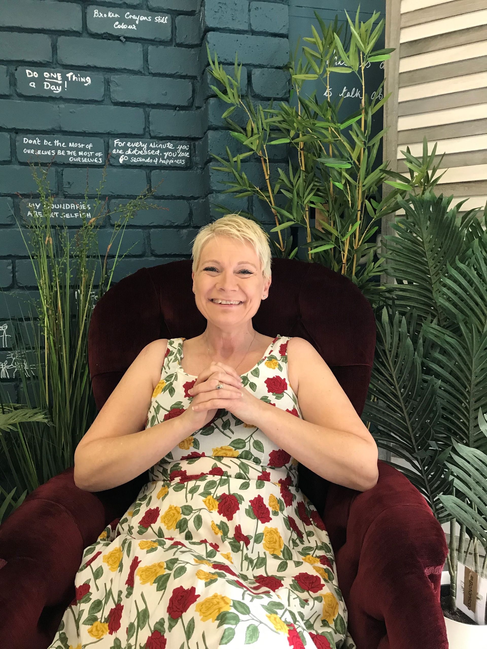 CArol in her red therapy chair — The Red Chair Therapy in Blackwall, NSW
