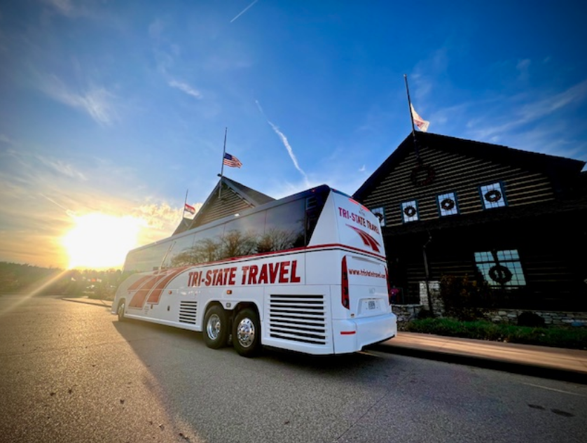 White tour bus labeled