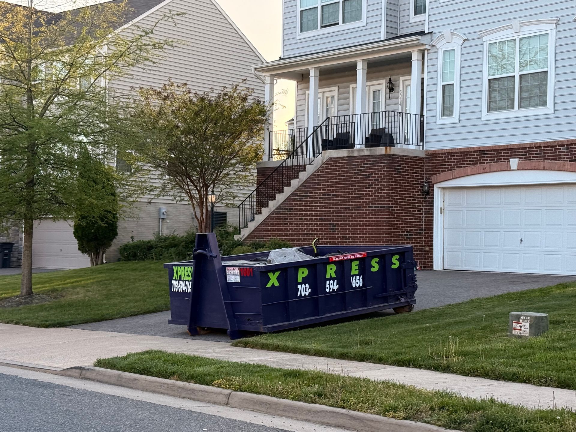 Full roll off dumpster after home cleanout project in Northern Virginia ready for pickup
