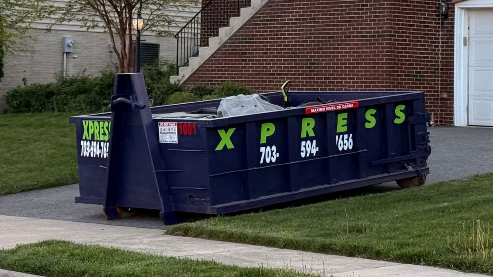 Full roll off dumpster after home cleanout project in Northern Virginia ready for pickup