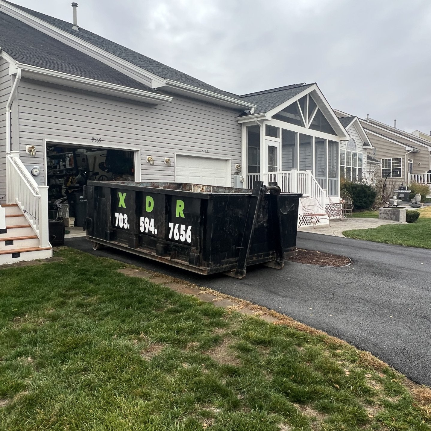 dumpster rental in Bristow VA driveway placement