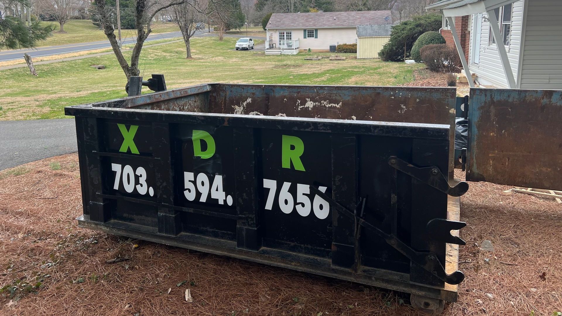 Driveway-safe heavy debris dumpster delivery in Northern Virginia”