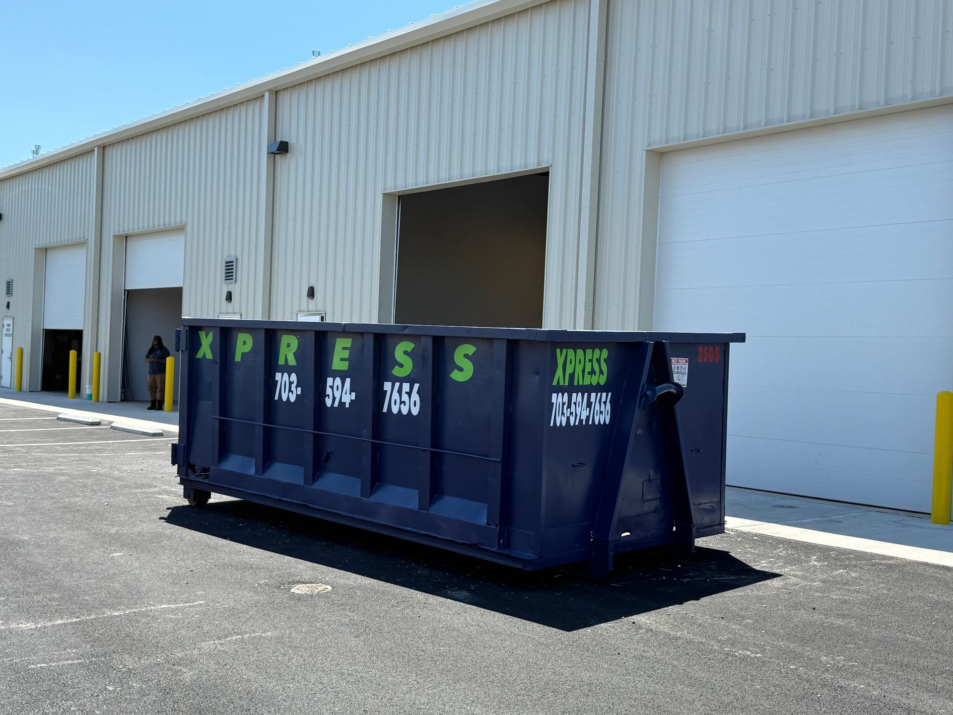 Roll-off dumpster positioned on a job site in Prince William County for commercial construction wast