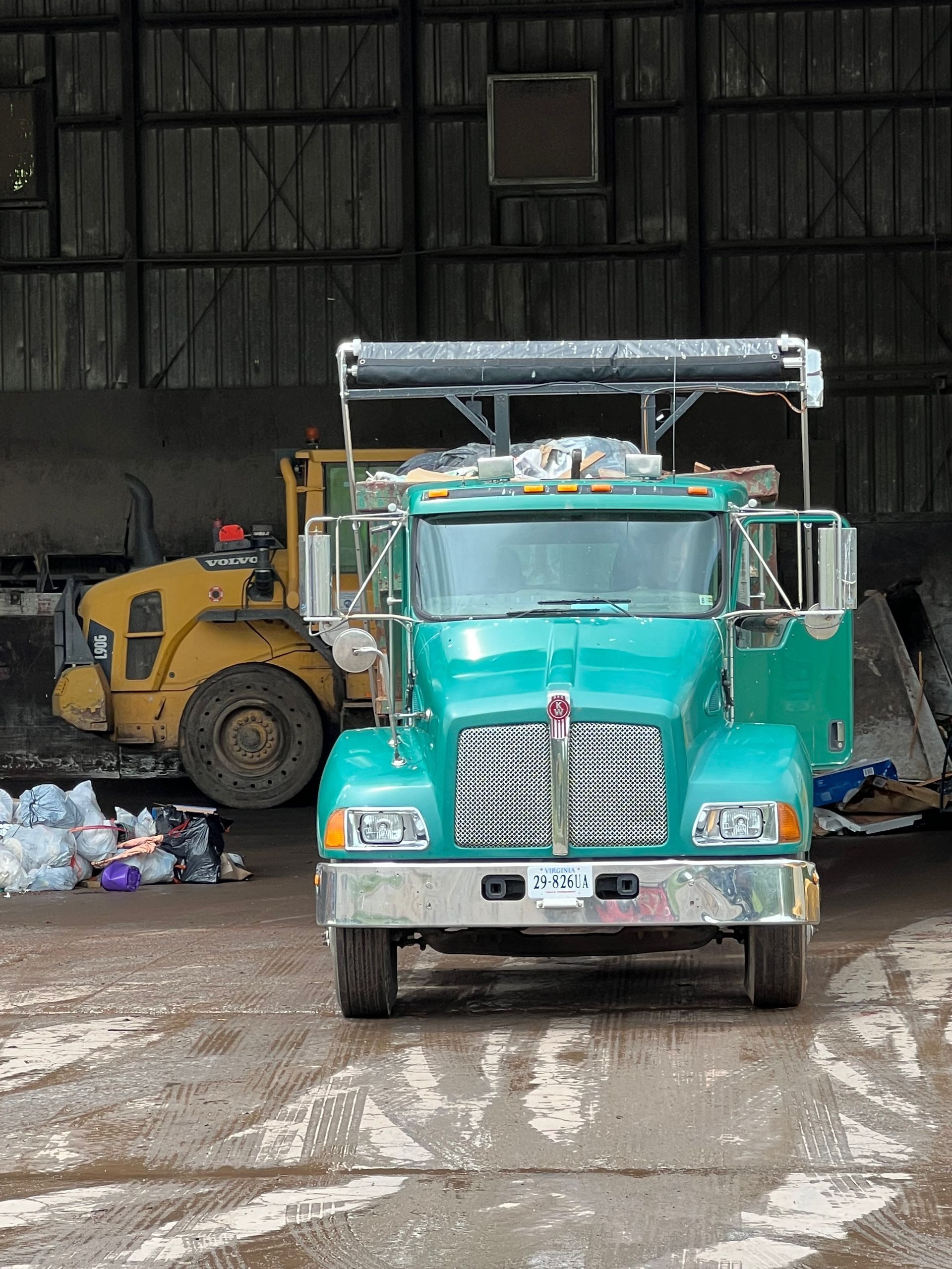 Construction dumpster rental filled with contractor debris on job site in Culpeper VA