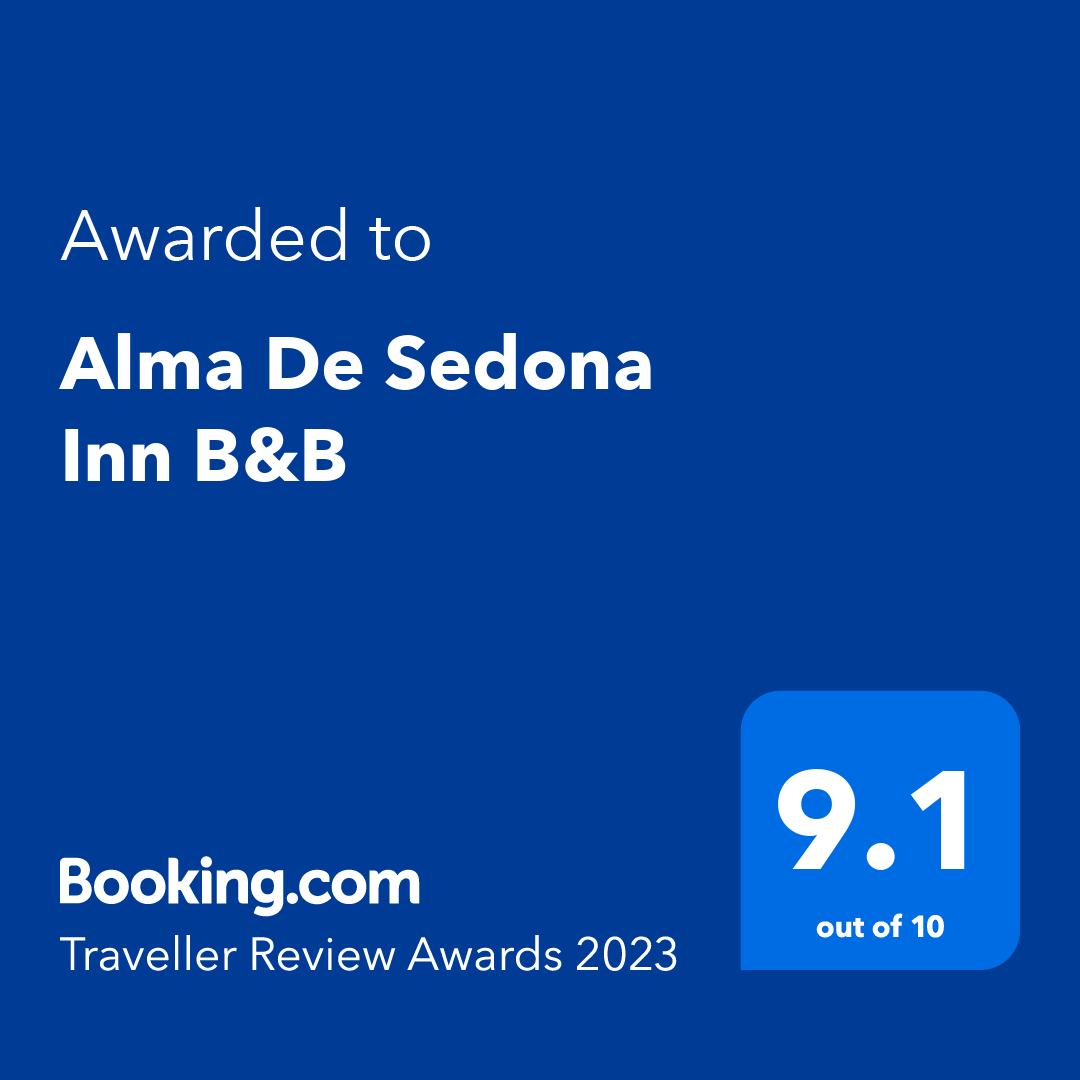 A blue sign that says `` awarded to alma de sedona inn b & b ''